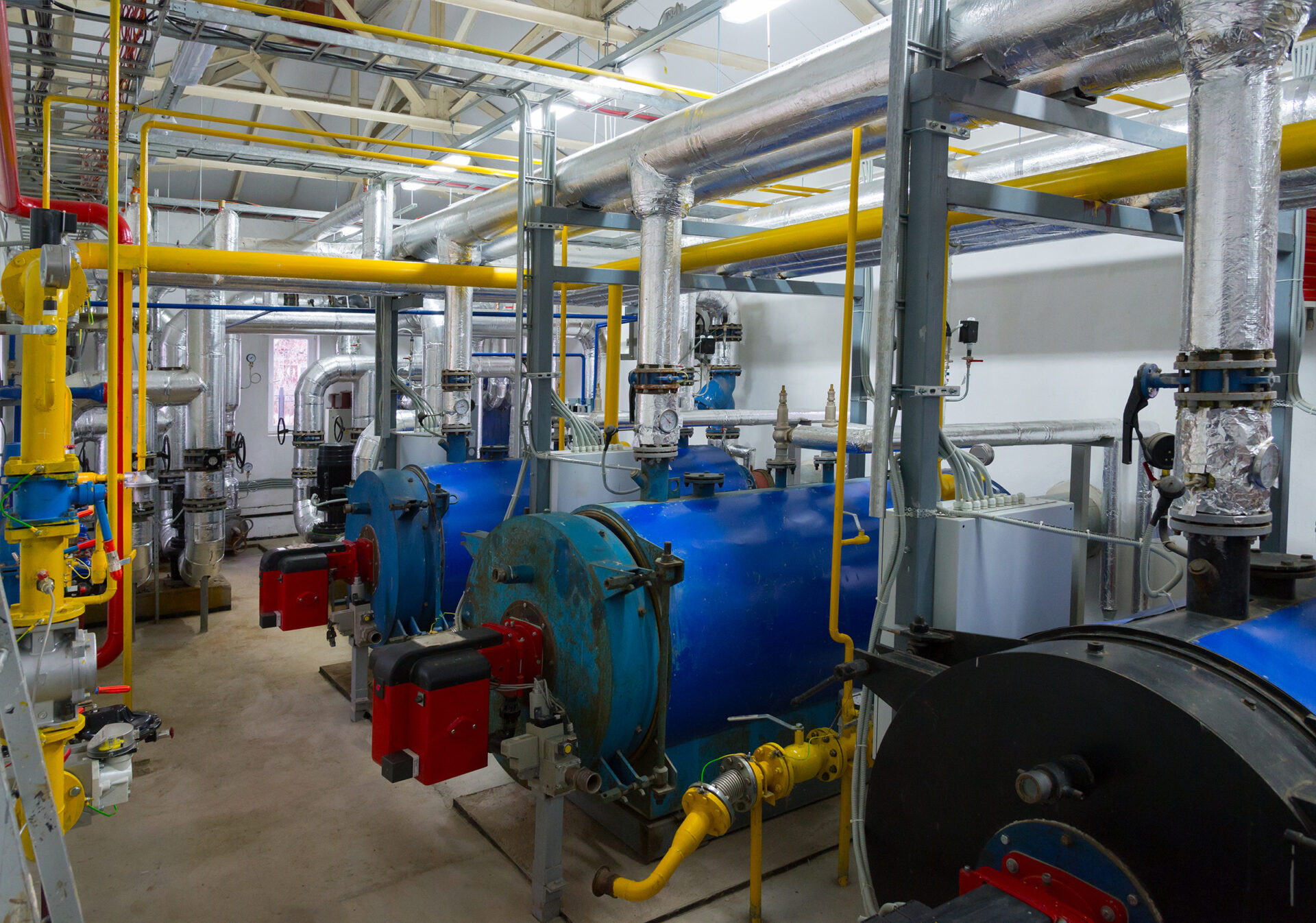 Place in a large industrial boiler room. LCD Mechanical Inc